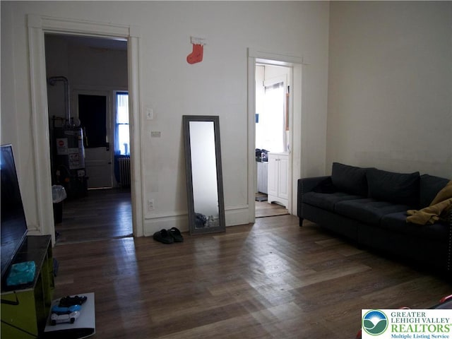 266 E Walnut St, Allentown City, PA 18109 - living room with wood finished floors and water heater