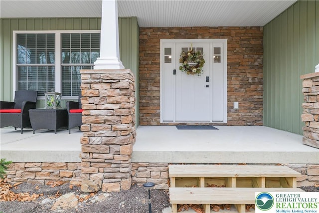 119 Tenicum Trl, Coolbaugh Twp, PA 18347 - doorway to property featuring covered porch and stone siding