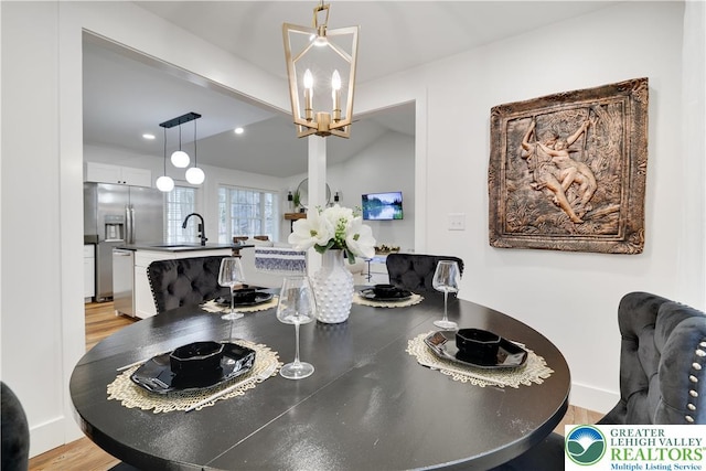 119 Tenicum Trl, Coolbaugh Twp, PA 18347 - dining space with a chandelier and light wood-type flooring