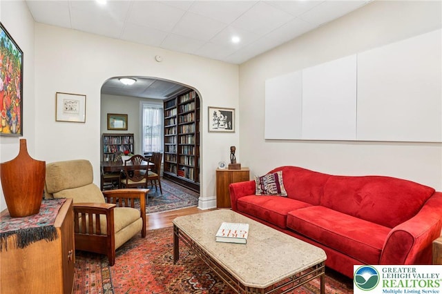 337 N 10th St, Allentown City, PA 18102 - living area featuring arched walkways, wood finished floors, a paneled ceiling, and recessed lighting