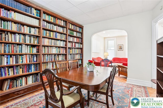 337 N 10th St, Allentown City, PA 18102 - dining room featuring arched walkways and light wood-style floors