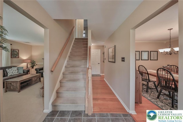 106 Fernwood Dr, Forks Twp, PA 18040 - stairs featuring a chandelier and baseboards