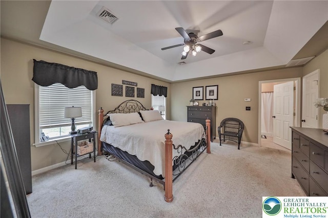 106 Fernwood Dr, Forks Twp, PA 18040 - bedroom featuring a tray ceiling, light carpet, and ceiling fan