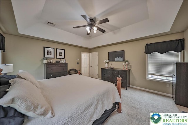 106 Fernwood Dr, Forks Twp, PA 18040 - bedroom with a tray ceiling, light colored carpet, and a ceiling fan