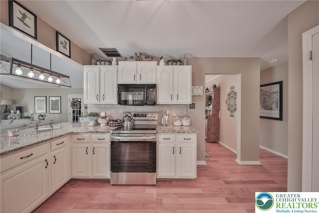106 Fernwood Dr, Forks Twp, PA 18040 - kitchen with black microwave, electric range, light wood-type flooring, tasteful backsplash, and light stone countertops