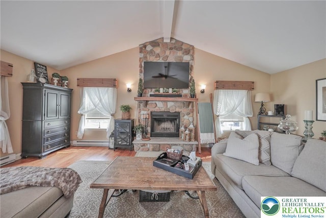 106 Fernwood Dr, Forks Twp, PA 18040 - living room with baseboard heating, light wood-style floors, a ceiling fan, and a fireplace