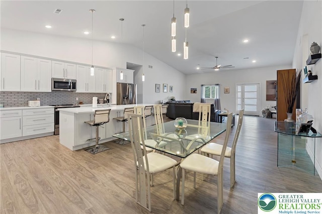 3670 N Dogwood Rd, Lehigh Twp, PA 18038 - dining area featuring light wood-style floors, ceiling fan, lofted ceiling, and recessed lighting