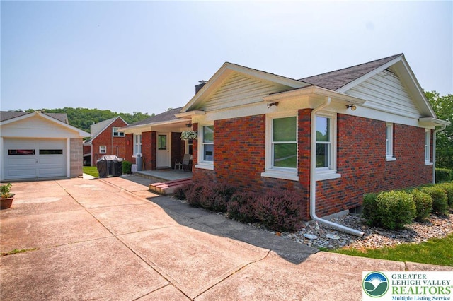 6790 Fairview Ave, Lower Mt Bethel Twp, PA 18013 - single story home featuring concrete driveway, brick siding, a chimney, a detached garage, and an outdoor structure