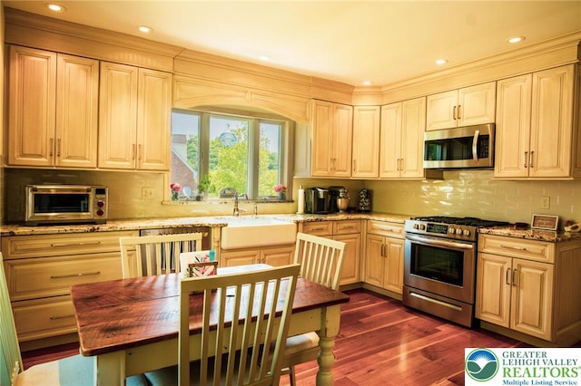 6790 Fairview Ave, Lower Mt Bethel Twp, PA 18013 - kitchen with stainless steel appliances, decorative backsplash, dark wood-type flooring, light stone counters, and recessed lighting