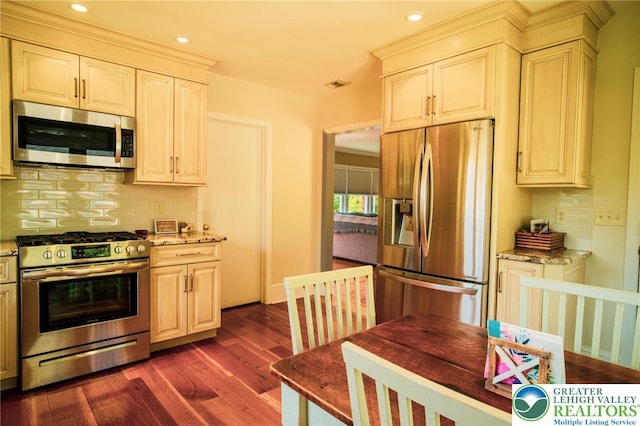6790 Fairview Ave, Lower Mt Bethel Twp, PA 18013 - kitchen with appliances with stainless steel finishes, dark wood-type flooring, decorative backsplash, light stone countertops, and recessed lighting