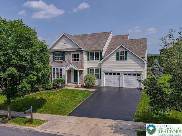 3213 Overlook Dr, Lower Macungie Twp, PA 18049 - view of front of home featuring asphalt driveway, a front lawn, and stone siding