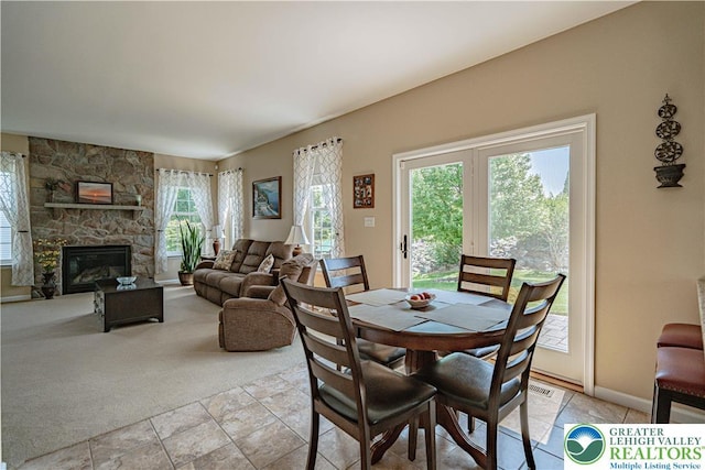 3213 Overlook Dr, Lower Macungie Twp, PA 18049 - dining area with a fireplace and light colored carpet