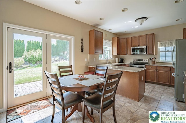 3213 Overlook Dr, Lower Macungie Twp, PA 18049 - dining space with healthy amount of natural light, light tile patterned floors, and recessed lighting