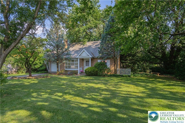3344 Winchester Rd, Allentown City, PA 18104 - view of front of house featuring a front lawn, a garage, and brick siding