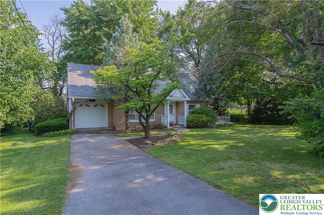 3344 Winchester Rd, Allentown City, PA 18104 - obstructed view of property with driveway, a garage, a front yard, and roof with shingles