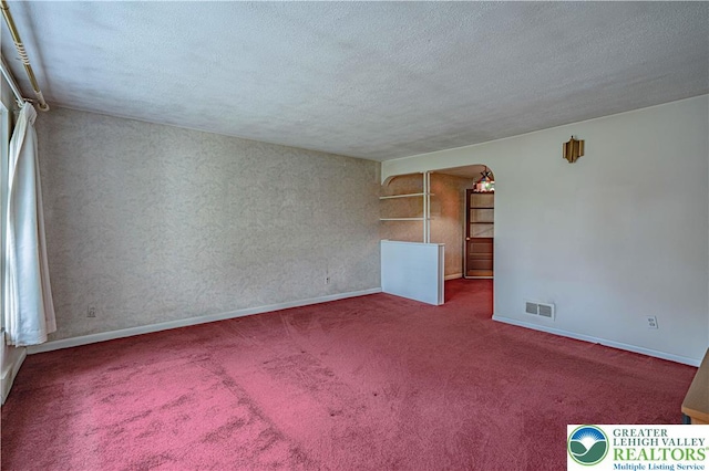 3344 Winchester Rd, Allentown City, PA 18104 - carpeted empty room featuring a textured ceiling and baseboards