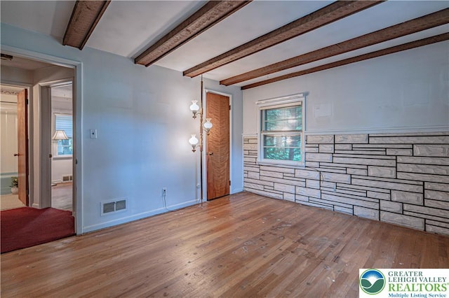 3344 Winchester Rd, Allentown City, PA 18104 - spare room with wood finished floors and beam ceiling