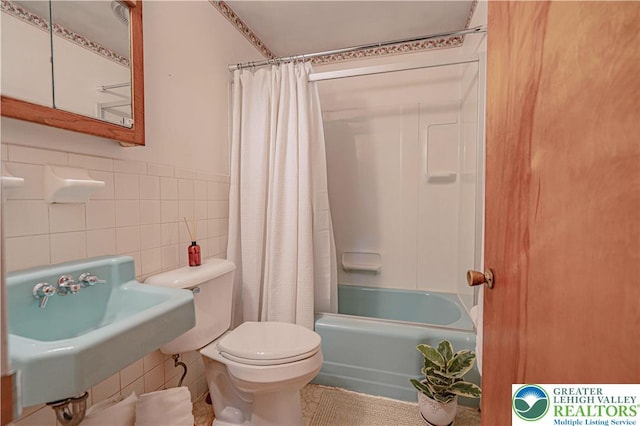 3344 Winchester Rd, Allentown City, PA 18104 - bathroom featuring tile walls and shower / tub combo with curtain