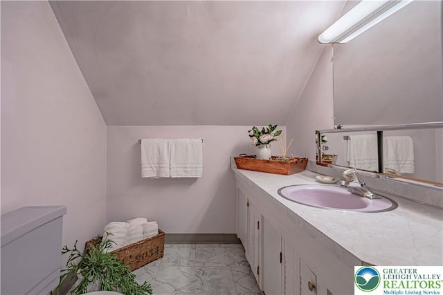 3344 Winchester Rd, Allentown City, PA 18104 - bathroom with marble look tiles, vanity, and lofted ceiling