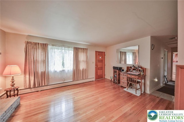 60 Maple Dr, Lower Towamensing Tp, PA 18071 - living room with wood finished floors and a baseboard heating unit