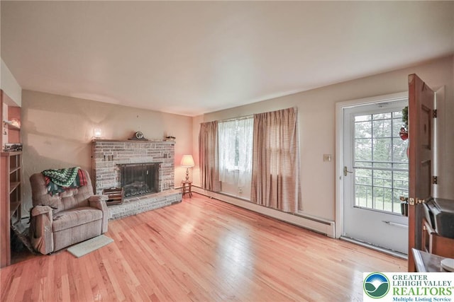 60 Maple Dr, Lower Towamensing Tp, PA 18071 - living room with wood finished floors, plenty of natural light, baseboard heating, and a fireplace