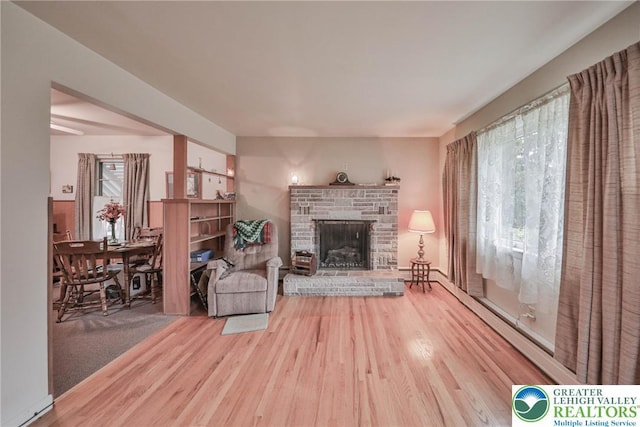 60 Maple Dr, Lower Towamensing Tp, PA 18071 - living room featuring wood finished floors and a fireplace with raised hearth