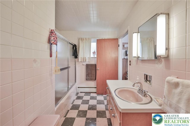 60 Maple Dr, Lower Towamensing Tp, PA 18071 - bathroom with a baseboard radiator, tile walls, vanity, enclosed tub / shower combo, and tile patterned floors