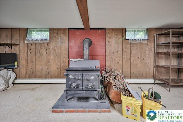 60 Maple Dr, Lower Towamensing Tp, PA 18071 - basement view of a wood stove, wooden walls, and a baseboard radiator