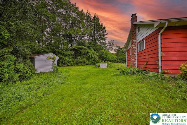 60 Maple Dr, Lower Towamensing Tp, PA 18071 - yard at dusk featuring a shed and a yard