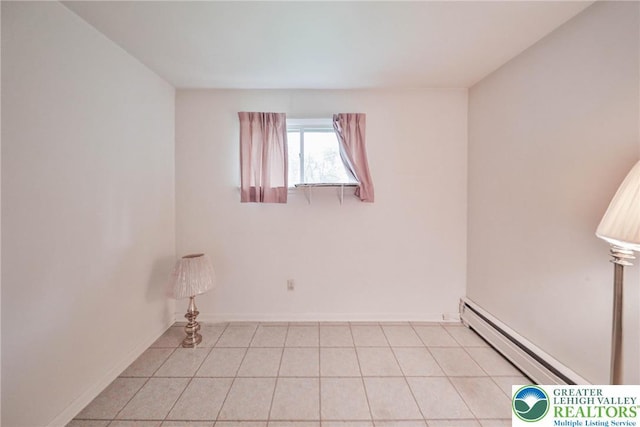60 Maple Dr, Lower Towamensing Tp, PA 18071 - unfurnished room featuring a baseboard heating unit and light tile patterned floors