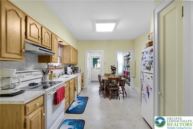 242 N Lehigh St, Tamaqua Boro, PA 18252 - kitchen with white appliances, under cabinet range hood, light countertops, and light tile patterned floors