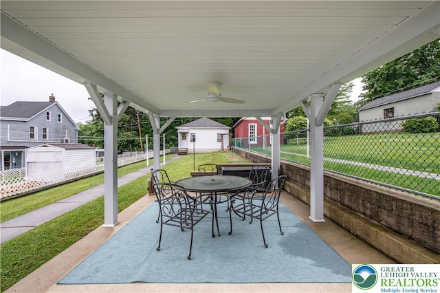 242 N Lehigh St, Tamaqua Boro, PA 18252 - view of patio with outdoor dining space, a ceiling fan, and an outbuilding
