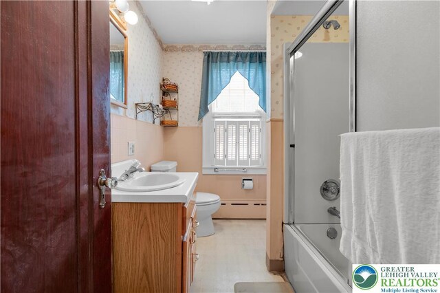 242 N Lehigh St, Tamaqua Boro, PA 18252 - bathroom with a baseboard heating unit, wallpapered walls, vanity, and combined bath / shower with glass door