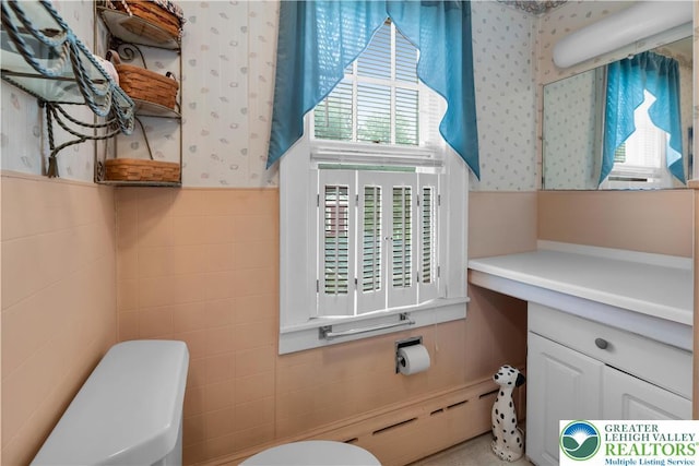 242 N Lehigh St, Tamaqua Boro, PA 18252 - half bath featuring tile walls, plenty of natural light, wallpapered walls, and vanity