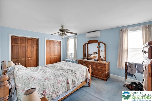 242 N Lehigh St, Tamaqua Boro, PA 18252 - carpeted bedroom featuring an AC wall unit, two closets, and ceiling fan