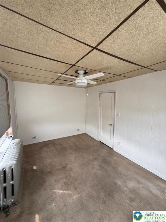 314 S Saint Cloud St, Allentown City, PA 18104 - carpeted empty room with ceiling fan, a drop ceiling, and radiator heating unit