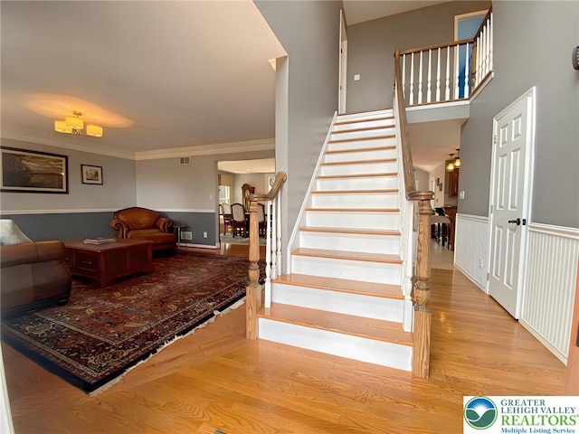 5545 Roberts Rd, North Whitehall Twp, PA 18078 - staircase with wood finished floors and crown molding