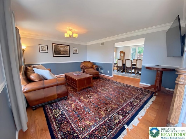 5545 Roberts Rd, North Whitehall Twp, PA 18078 - living area featuring ornamental molding and wood finished floors