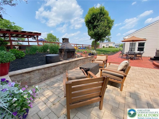 5545 Roberts Rd, North Whitehall Twp, PA 18078 - view of patio with outdoor dining space and an outdoor living space with a fireplace