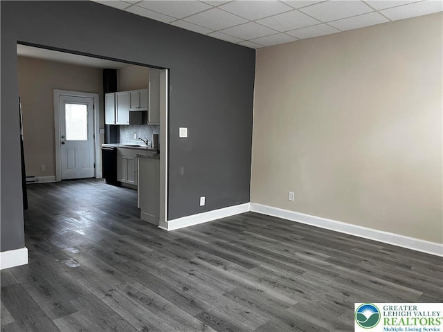142 Front St, Catasauqua Boro, PA 18032 - unfurnished living room with dark wood-style floors and a drop ceiling