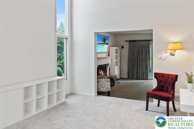75 Marshall Run, Allen Twp, PA 18067 - living area featuring carpet floors and a lit fireplace