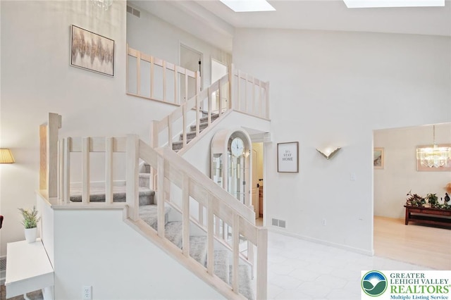 75 Marshall Run, Allen Twp, PA 18067 - stairway with a skylight, a towering ceiling, and a chandelier