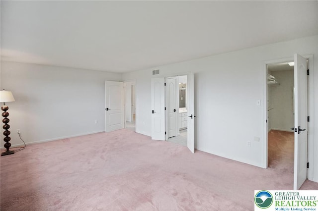 75 Marshall Run, Allen Twp, PA 18067 - unfurnished bedroom featuring carpet, a walk in closet, and ensuite bath