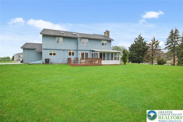 75 Marshall Run, Allen Twp, PA 18067 - back of house with a sunroom, a chimney, a lawn, and a wooden deck