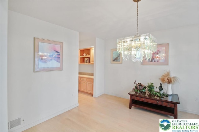 75 Marshall Run, Allen Twp, PA 18067 - hallway featuring a chandelier and light wood-style flooring