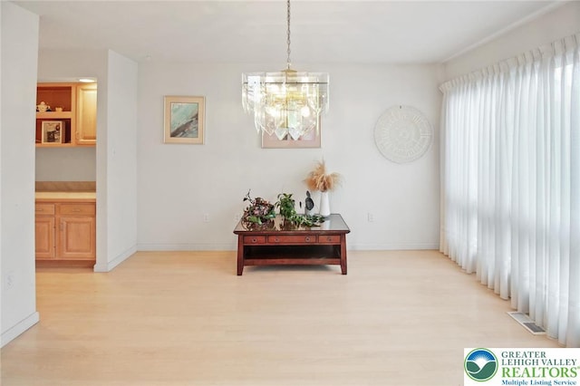 75 Marshall Run, Allen Twp, PA 18067 - hall featuring light wood finished floors and a chandelier