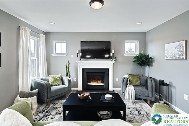 3220 Eisenhower Dr, Allen Twp, PA 18067 - living area with a fireplace with flush hearth, wood finished floors, and recessed lighting