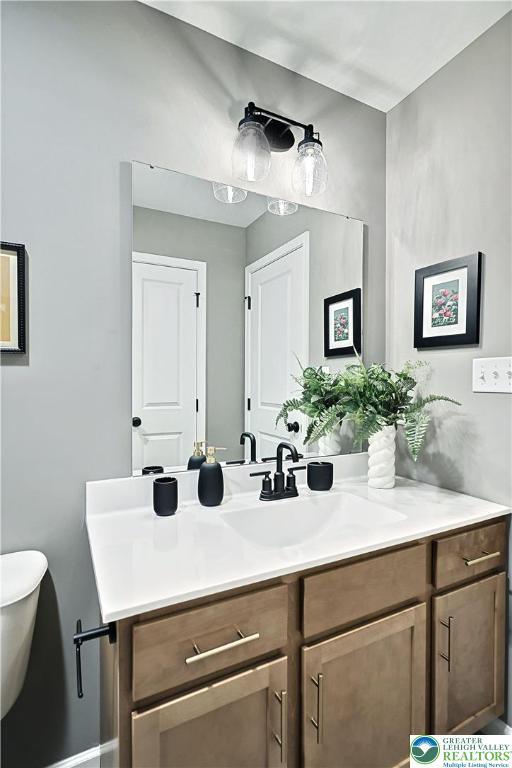 3220 Eisenhower Dr, Allen Twp, PA 18067 - half bathroom featuring vanity and toilet