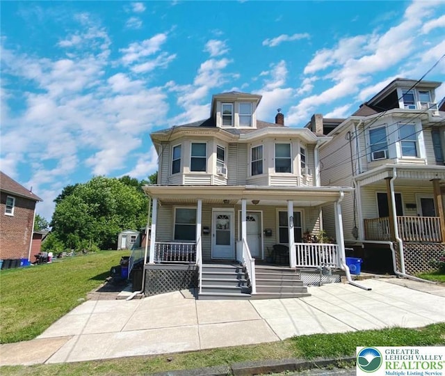 1139 Jackson St, Easton, PA 18042 - view of front of property featuring covered porch and a front lawn