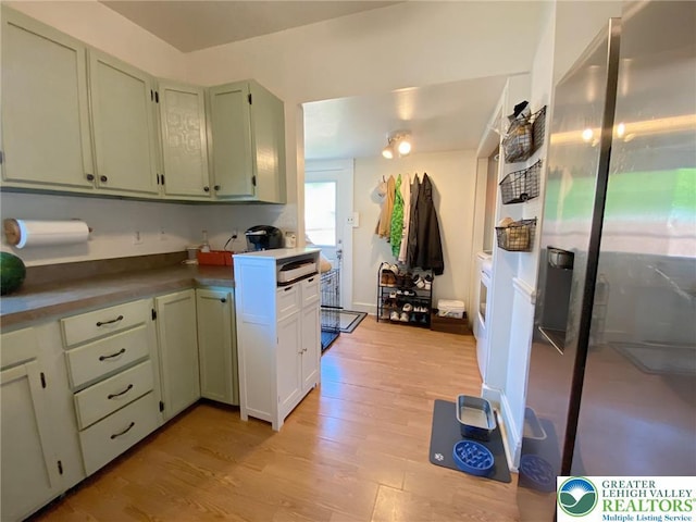 1139 Jackson St, Easton, PA 18042 - kitchen featuring light wood-style floors and stainless steel refrigerator with ice dispenser